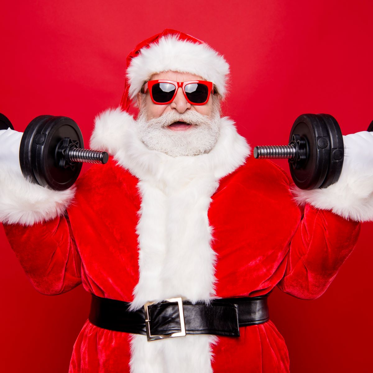 Santa lifting weights to stay fit this holiday