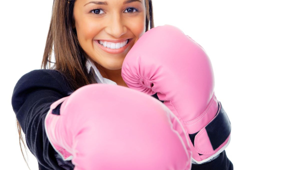 Businesswoman preparing for Houston fitness classes at work.